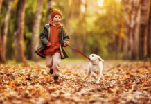 Training Tip: Kids and Dogs Child sitting calmly beside a family dog