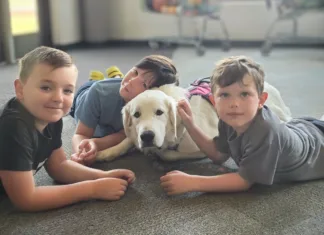 Paws in the Classroom Therapy dog Luna with students at Barnes Elementary School