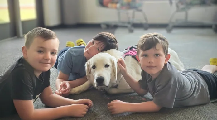 Paws in the Classroom Therapy dog Luna with students at Barnes Elementary School