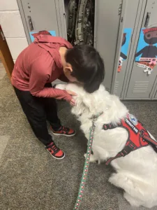 Therapy dogs are available when students may need help transitioning, giving encouragement and a moment to pause before entering class.