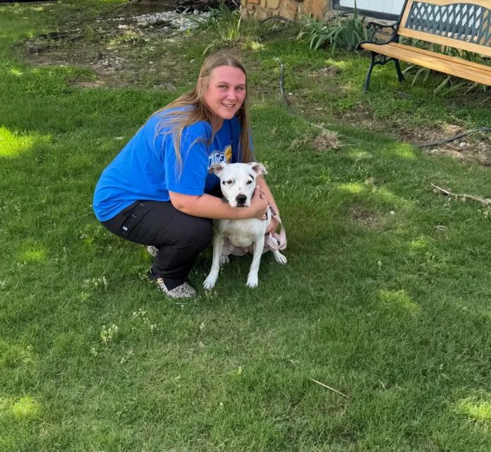 Michal Lahl with one of the many foster dogs who have found a temporary refuge in her home. Michal Lahl with one of the many foster dogs who have found a temporary refuge in her home.